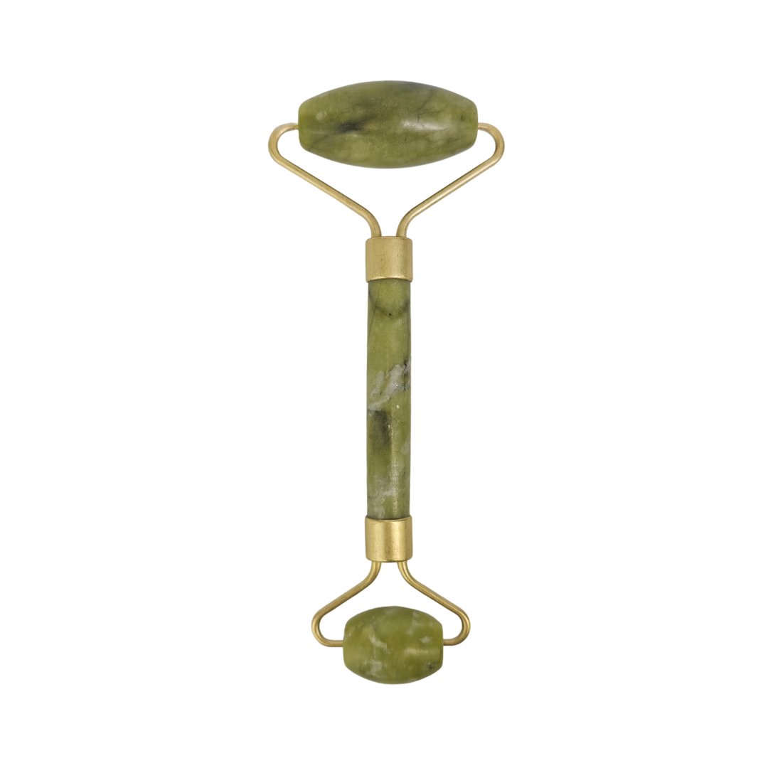 The green stone roller standing upright with a gold frame