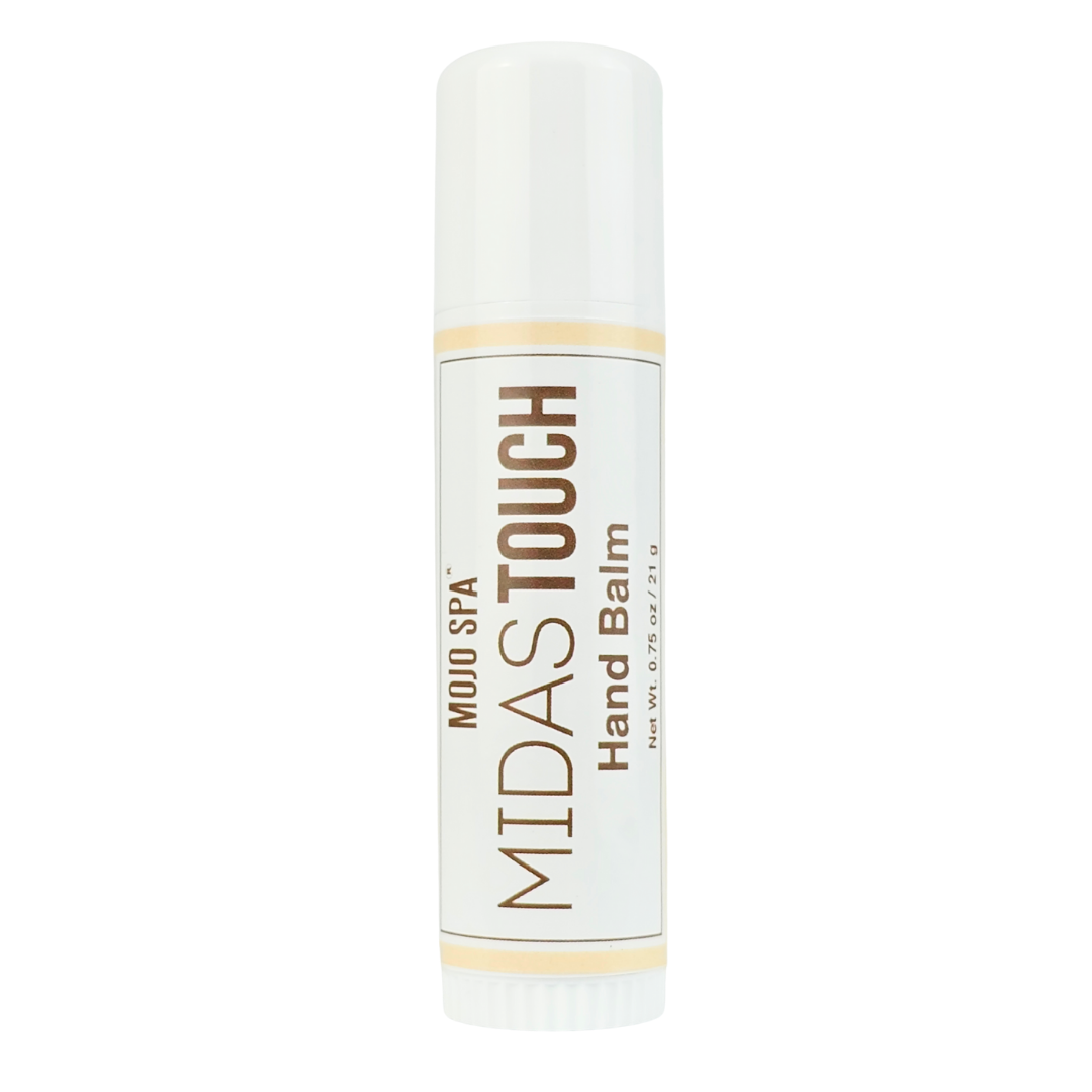 The balm in a white push-up stick tube, label reading Hand Balm