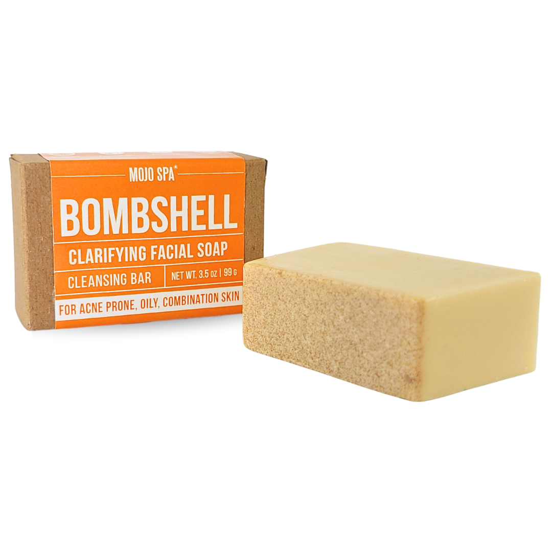 The cream-coloured bar out of its box, its textured speckled face visible beside the box
