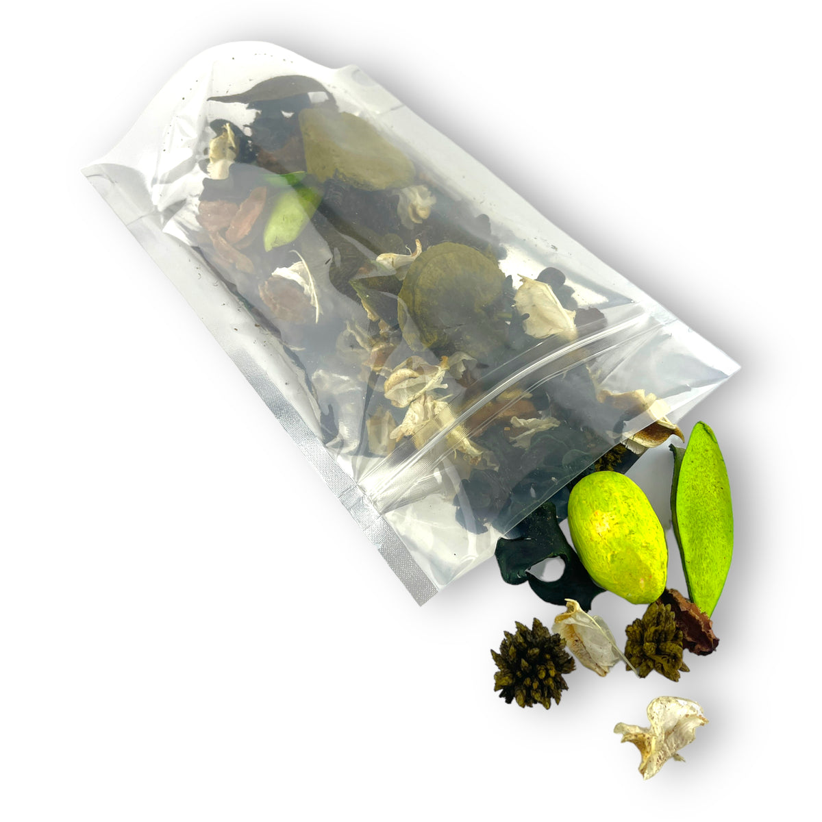 A clear zip pouch tipped over, dried leaves and pods spilling out
