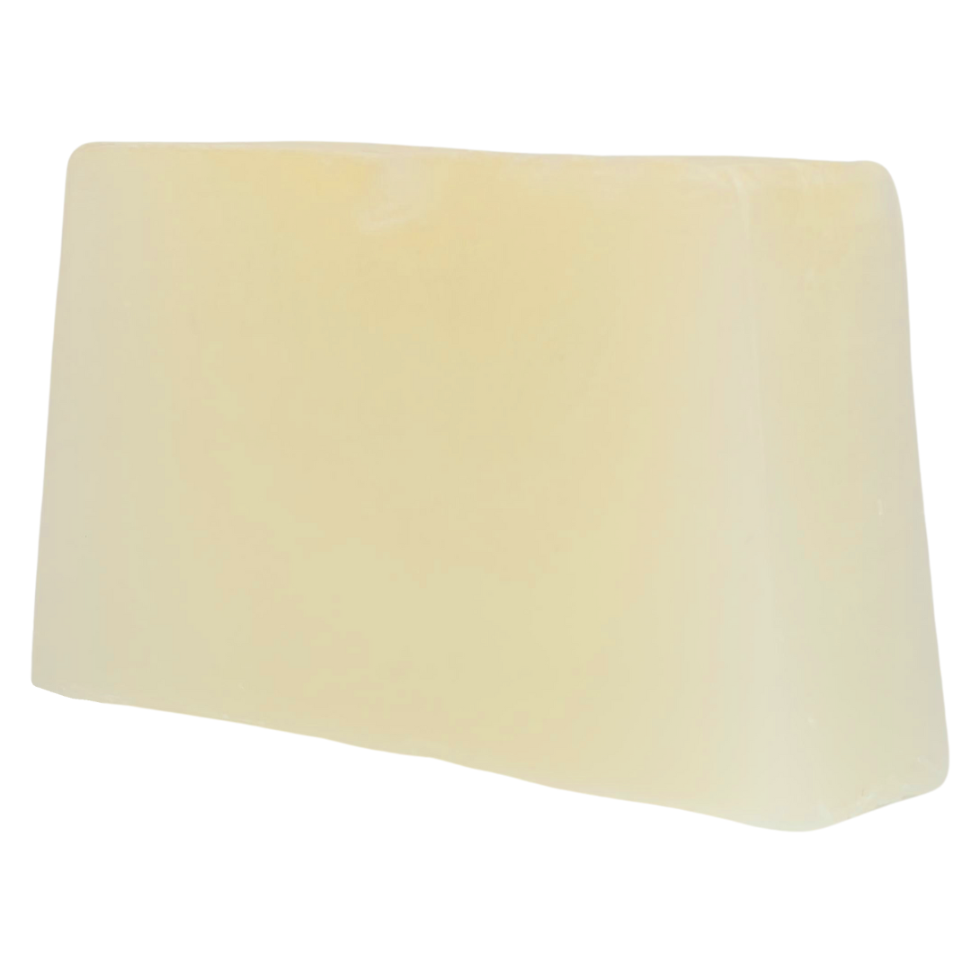 The plain pale yellow soap bar out of its wrap, seen at an angle