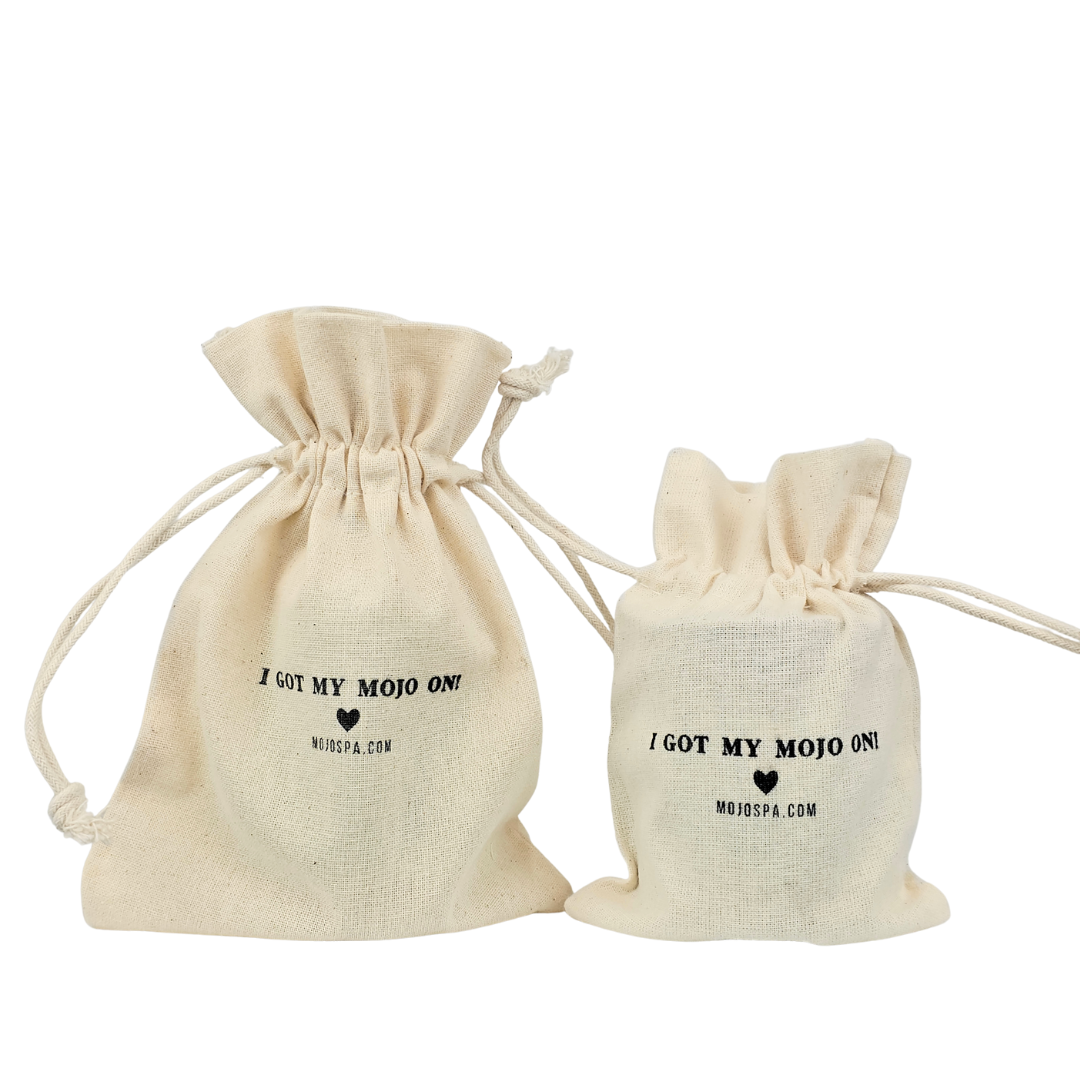 Two sizes of cream drawstring bag, each printed I Got My Mojo On
