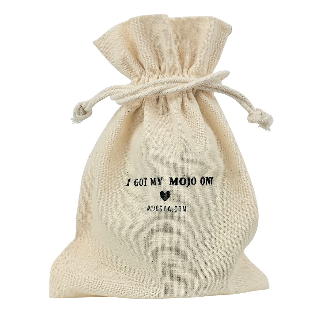 A cream cotton drawstring bag printed I Got My Mojo On, with a heart