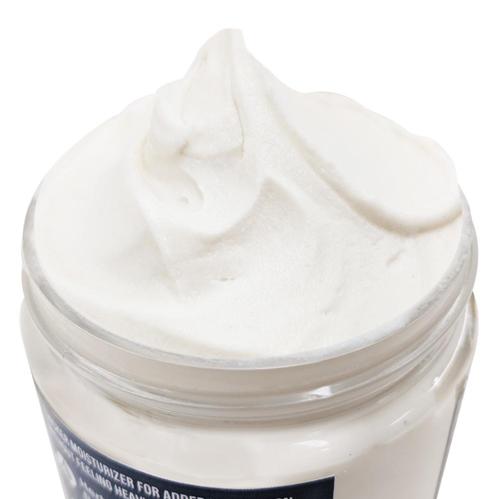 The open jar, showing the soft whipped white moisturizer