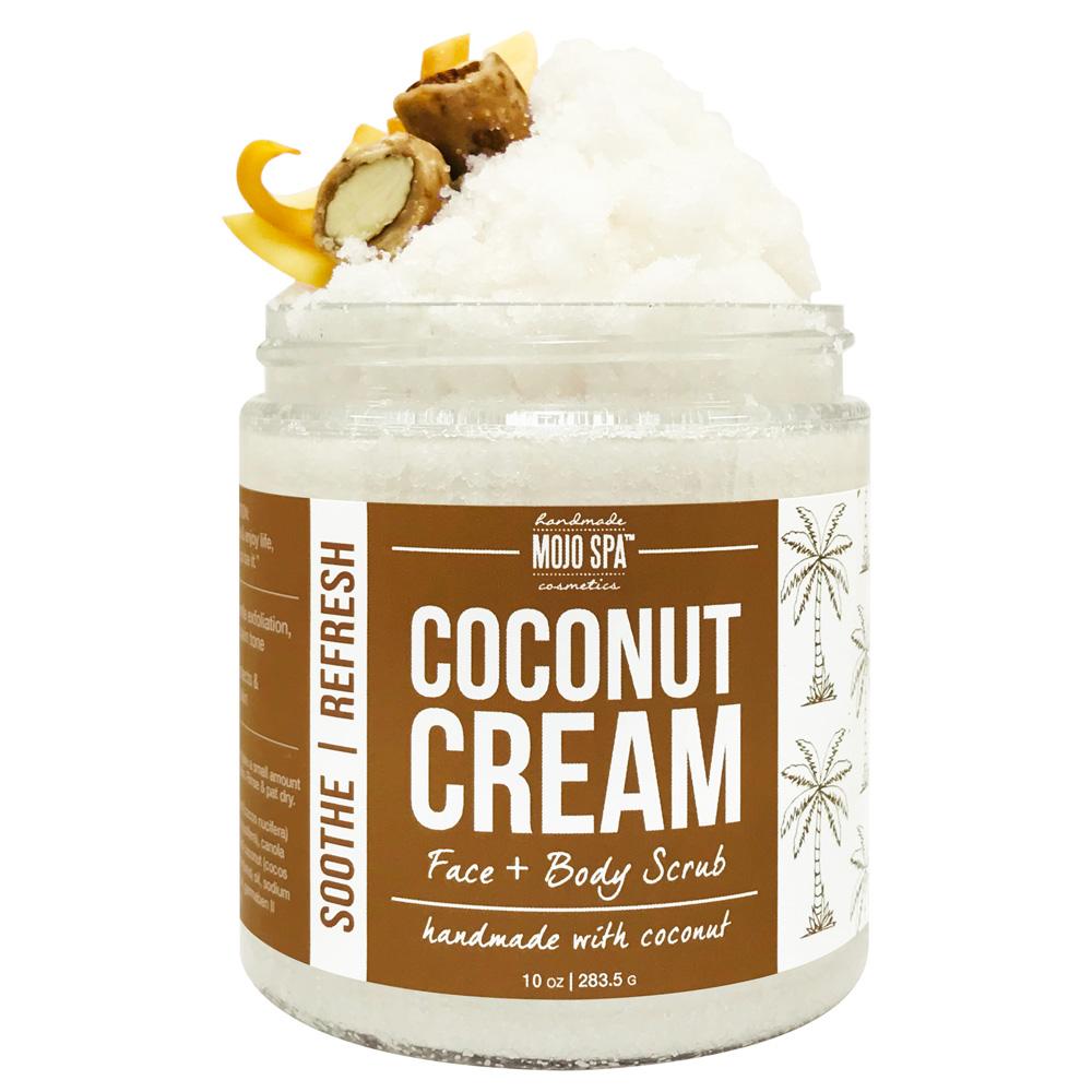Coconut Cream face and body scrub in a 10 oz jar, white scrub piled high with a nut and citrus peel garnish, brown palm tree label