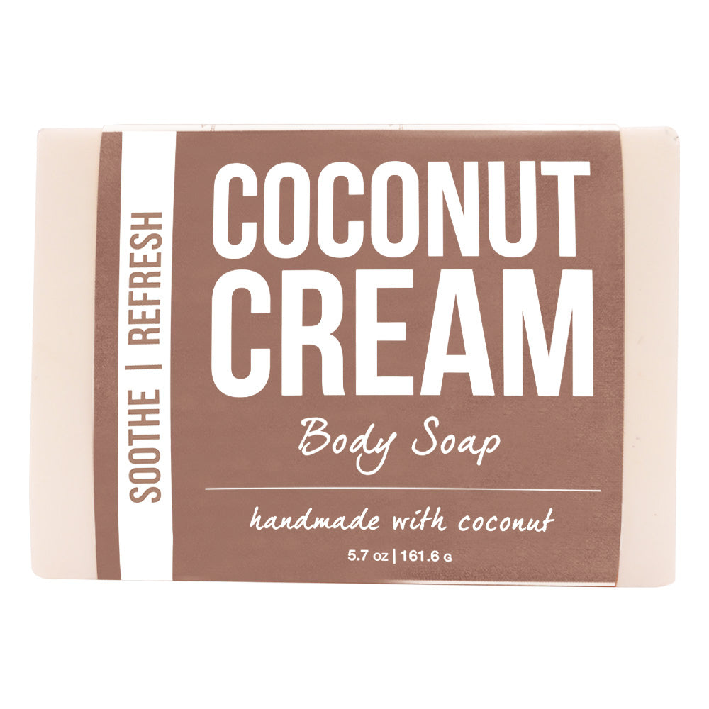 The body soap bar, cream-coloured with a brown wrap label reading handmade with coconut