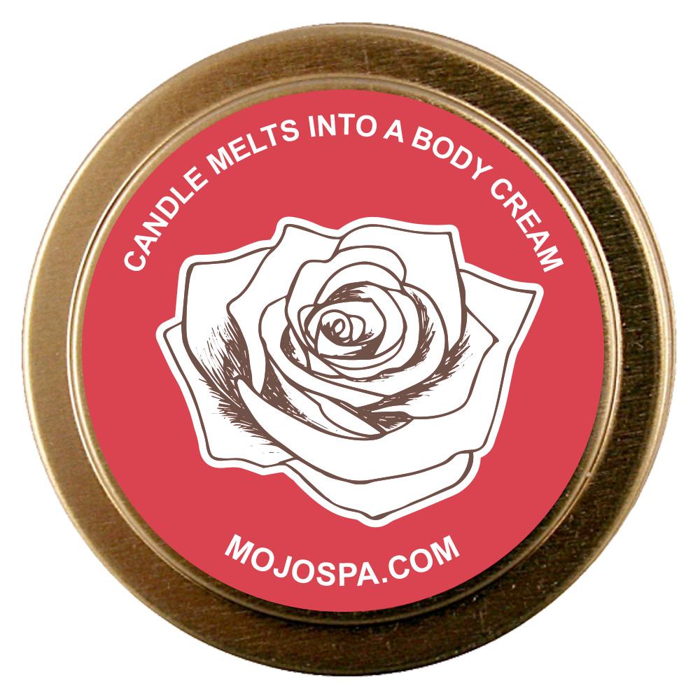 The gold tin lid with a red centre, a drawing of a rose and the line Candle melts into a body cream, with mojospa.com
