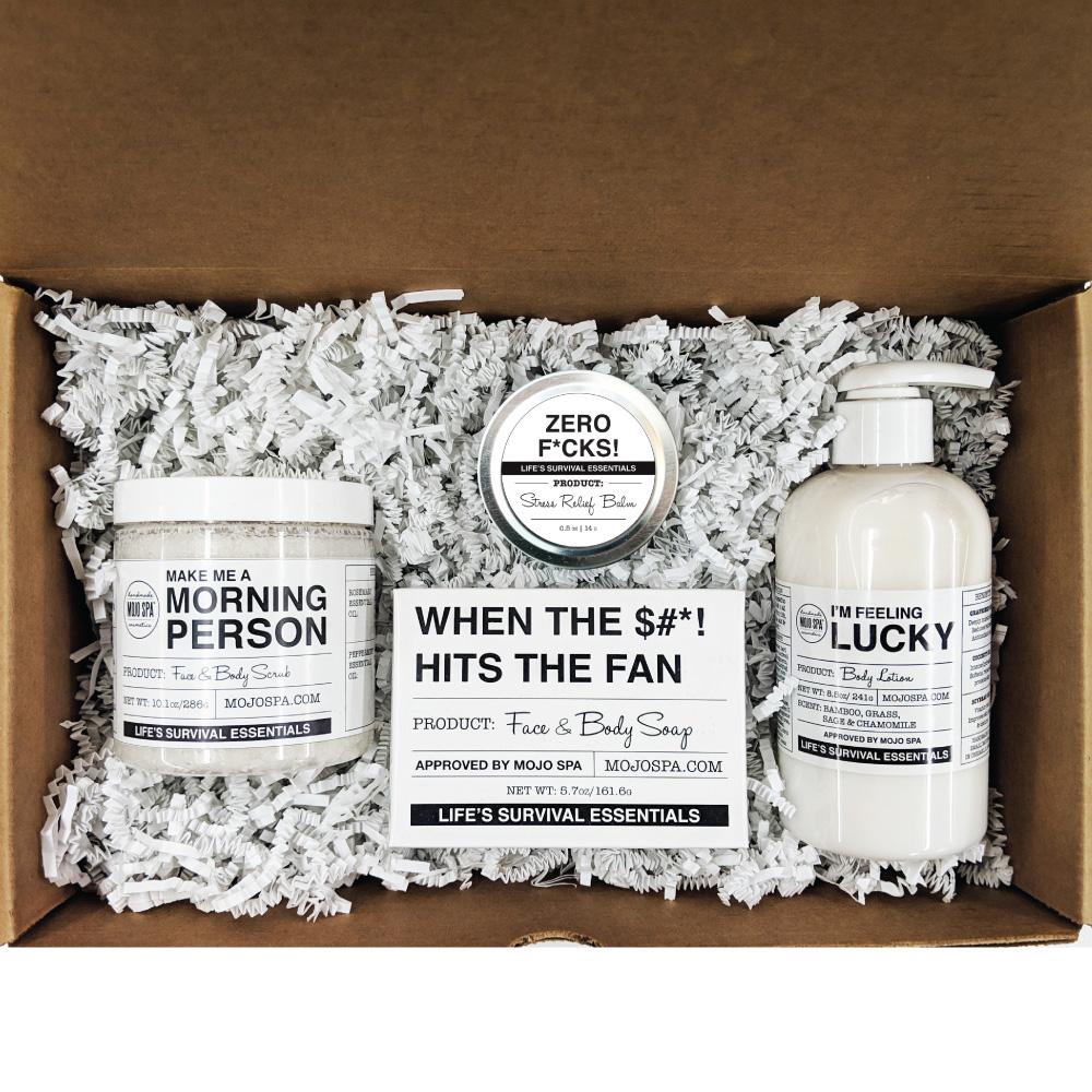The four products in an open brown kraft box on white paper shred