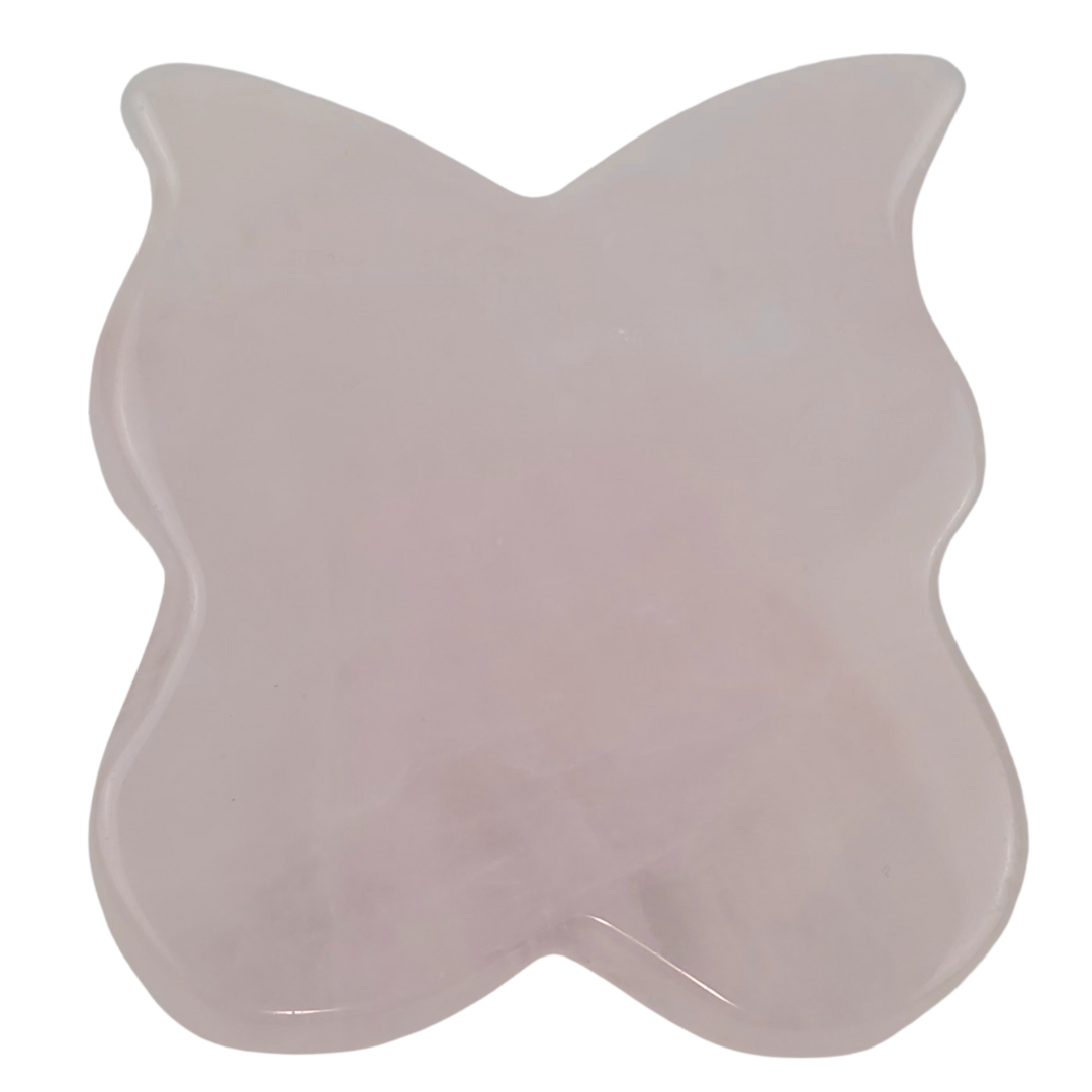 The pink stone butterfly tool laid flat from above