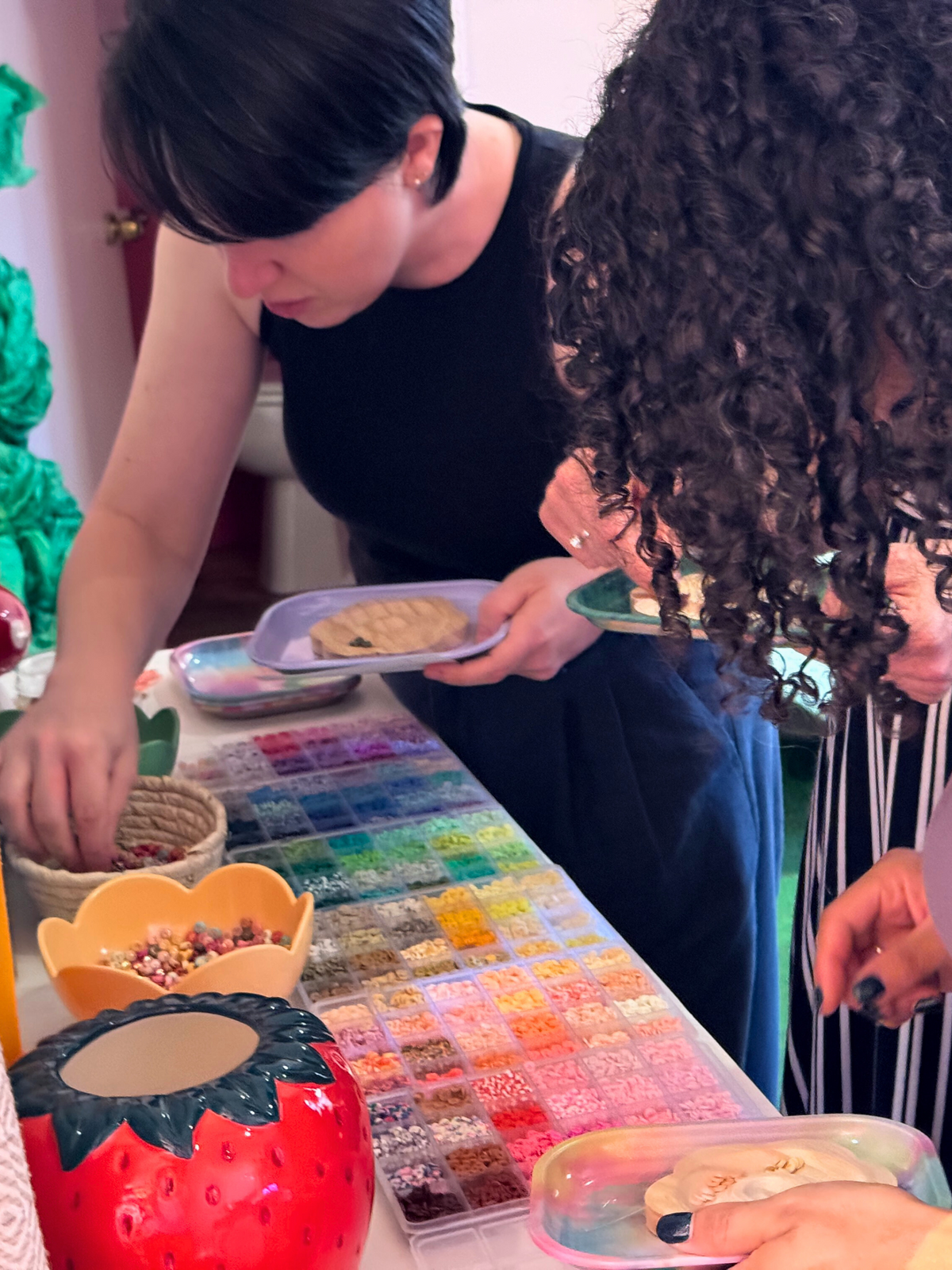Guests picking beads at the friendship bracelet bar