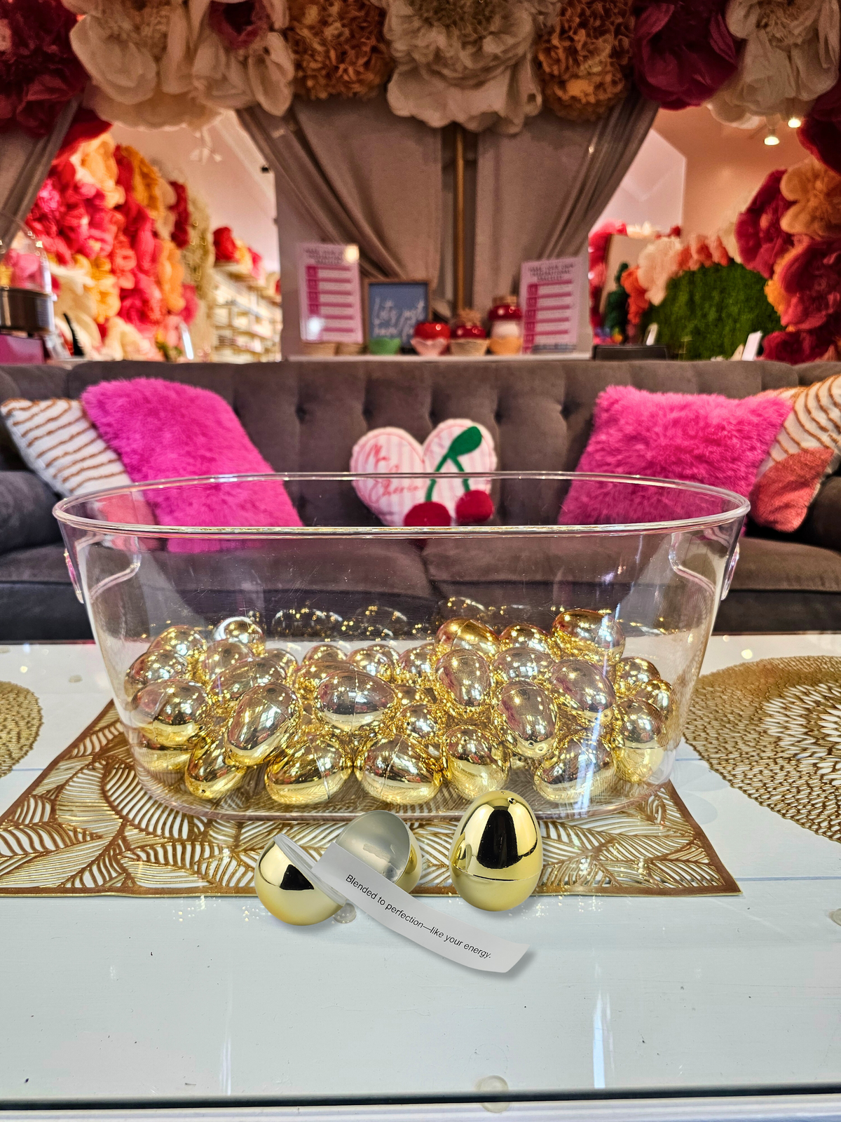 A bowl of golden eggs for the Beauty Oracle, one opened to show its message