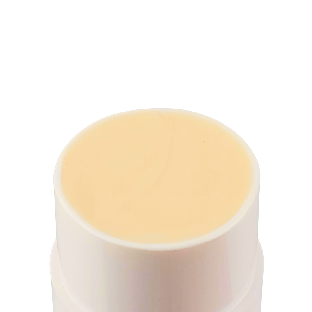 The top of the stick open, showing the smooth cream-colored balm