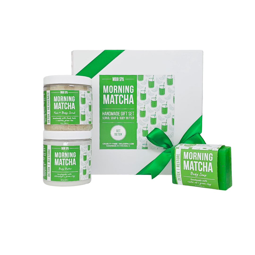 Morning Matcha scrub, body butter and soap gift set, a white box tied with a green ribbon beside two stacked jars and a soap bar