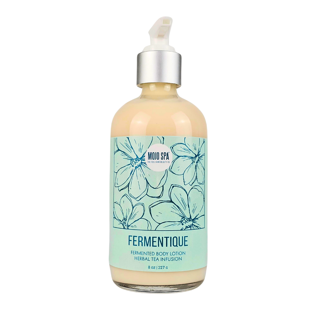 Fermentique body lotion in an 8 oz glass pump bottle, the label reading Fermented Body Lotion, Herbal Tea Infusion