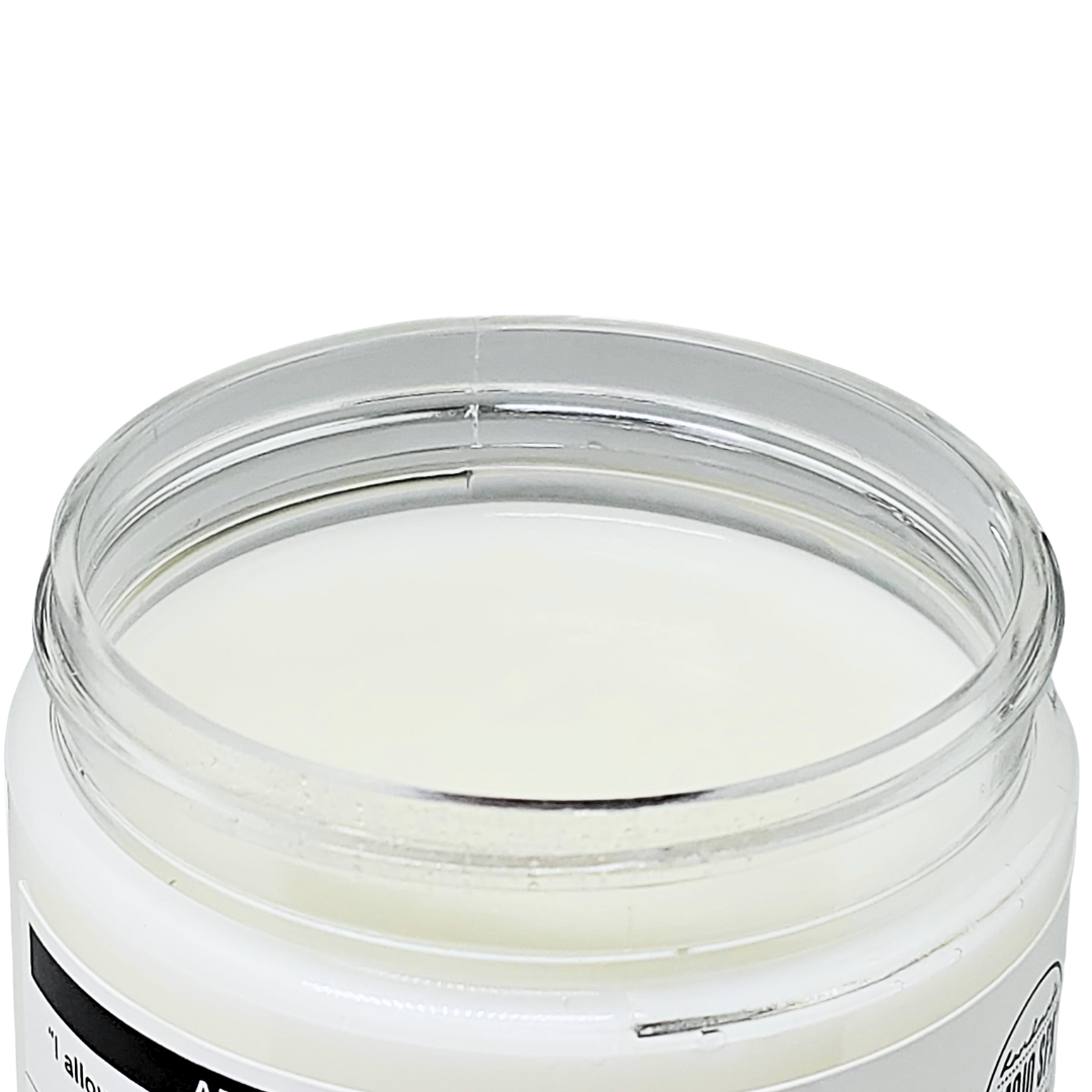 The open jar, showing the smooth white moisturizer