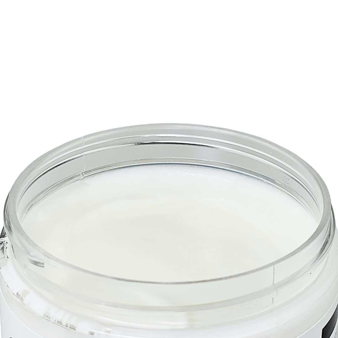 The open jar, showing the smooth white cream