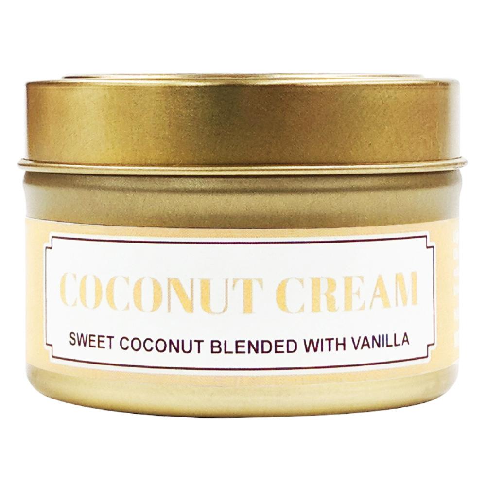 Coconut Cream soy massage candle in a gold tin with a cream label reading sweet coconut blended with vanilla
