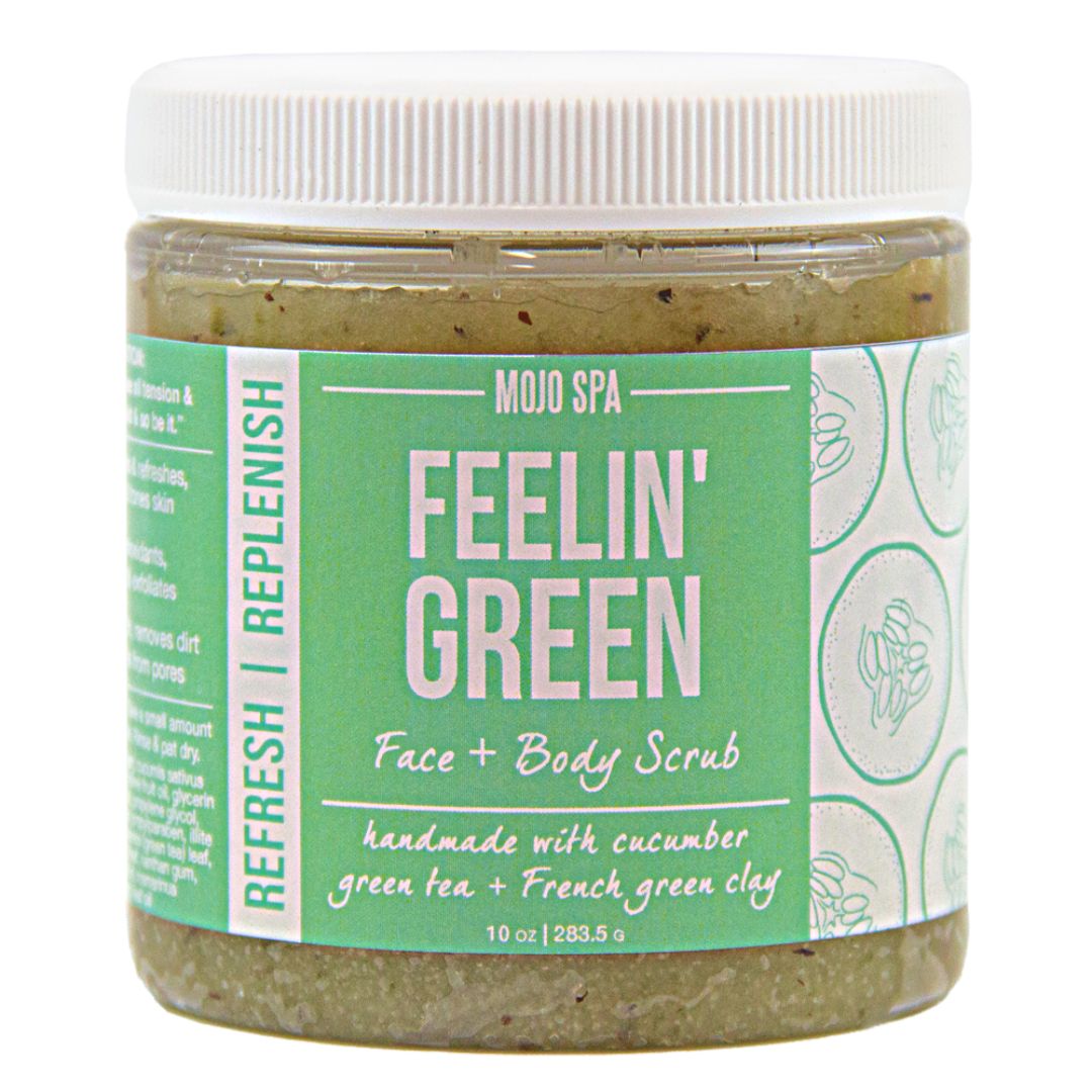 The jar with its white lid closed, label reading handmade with cucumber, green tea + French green clay