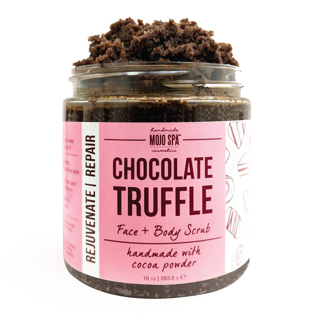 The face and body scrub jar from the set, open and piled high with dark scrub