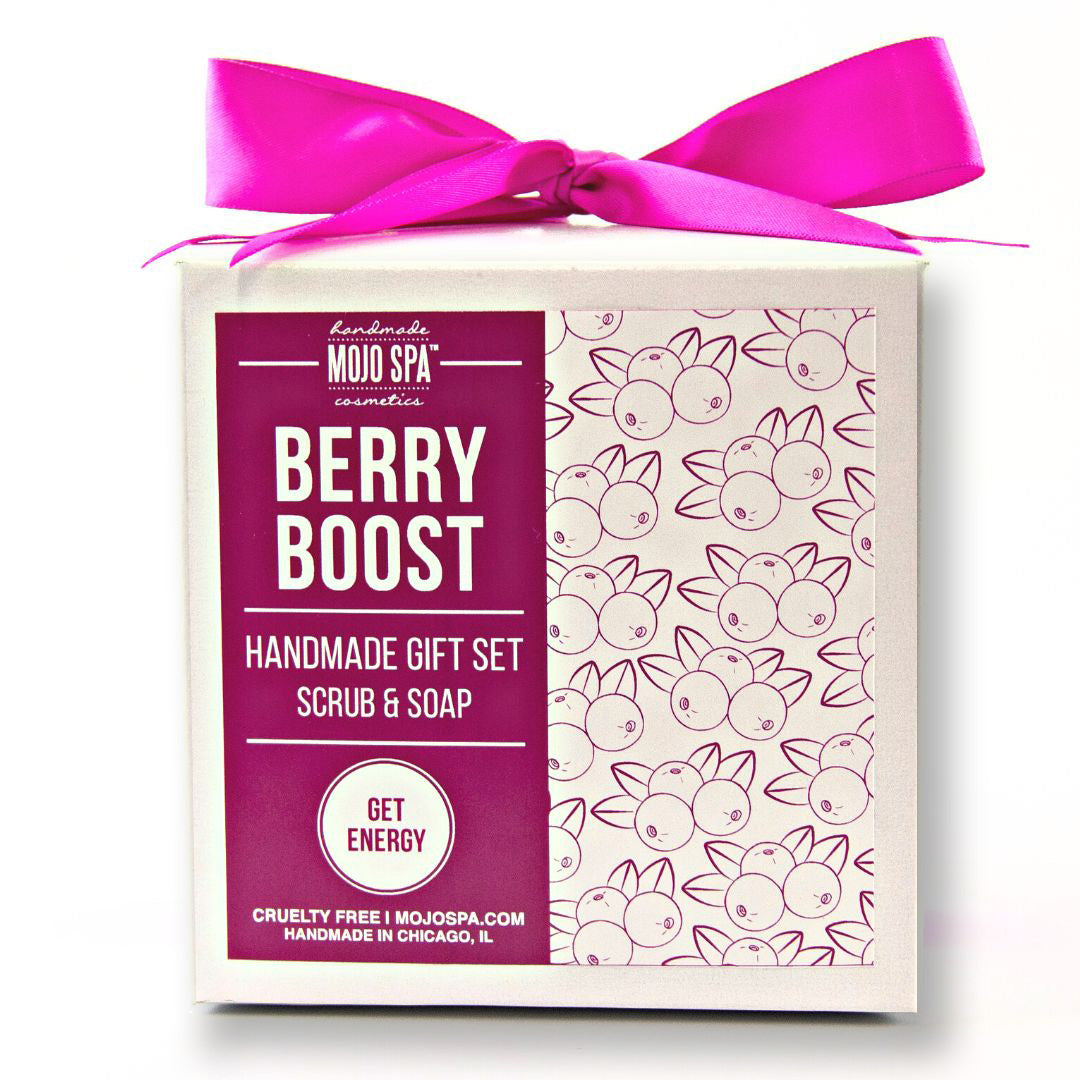 Berry Boost scrub and soap gift set, a white box with a berry pattern panel, tied with a bright pink ribbon