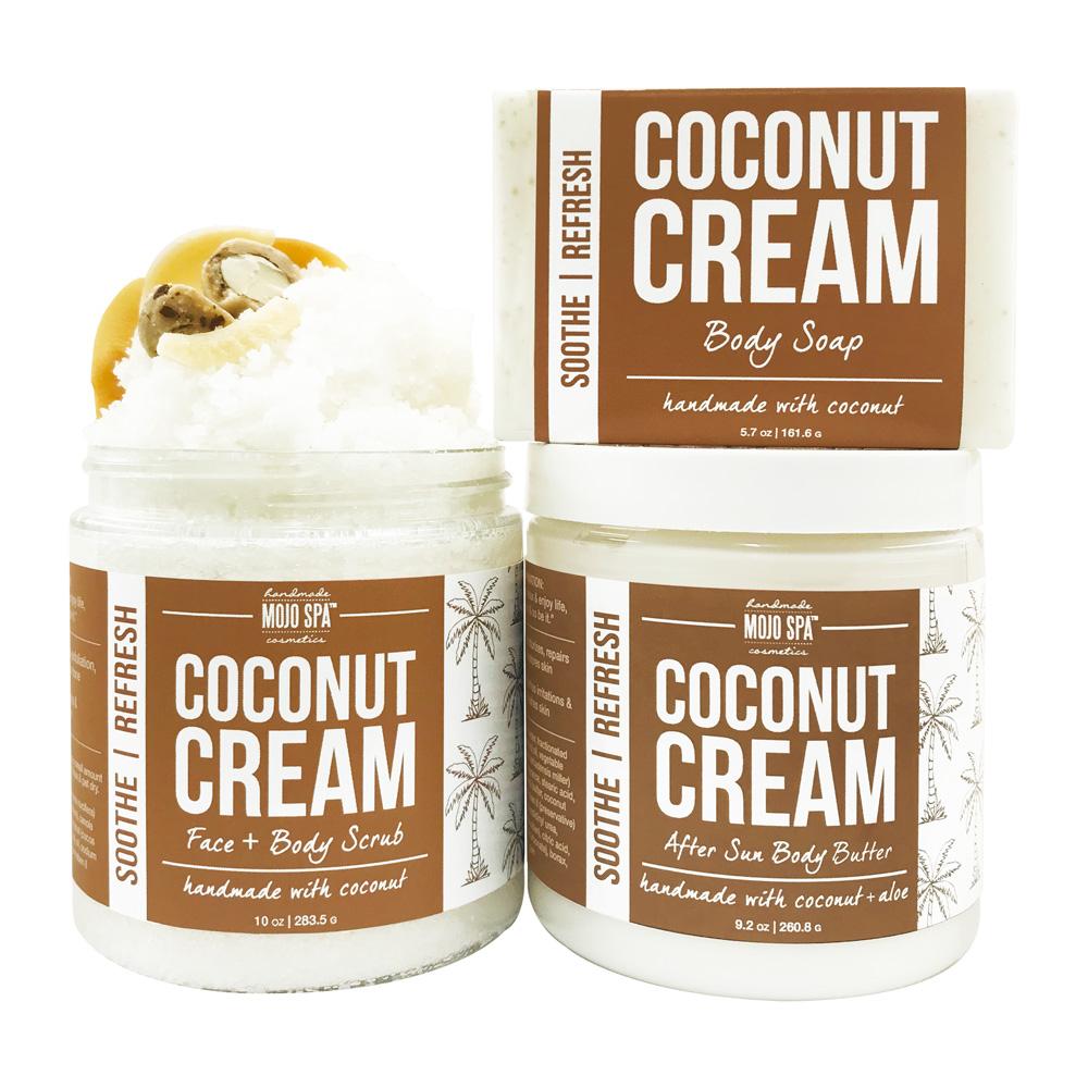 The scrub jar, body soap bar and body butter jar grouped together, all with matching brown labels, the scrub topped with a nut garnish