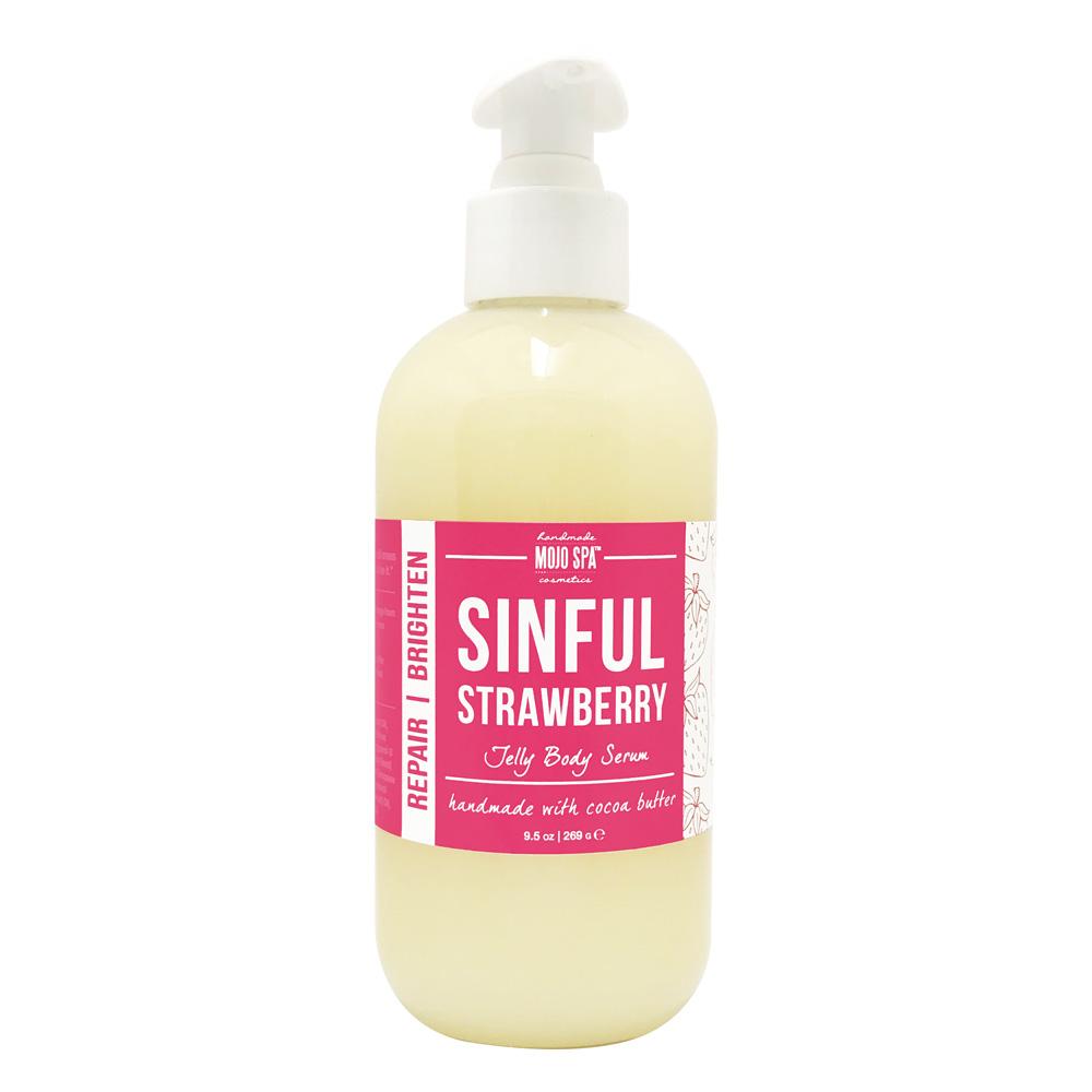 The jelly body serum in a clear pump bottle, pale yellow serum behind a pink label reading handmade with cocoa butter
